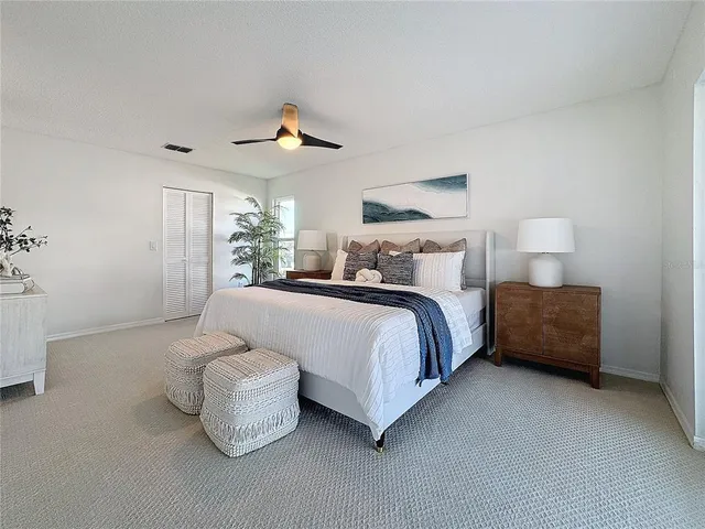 a bedroom with bed and window