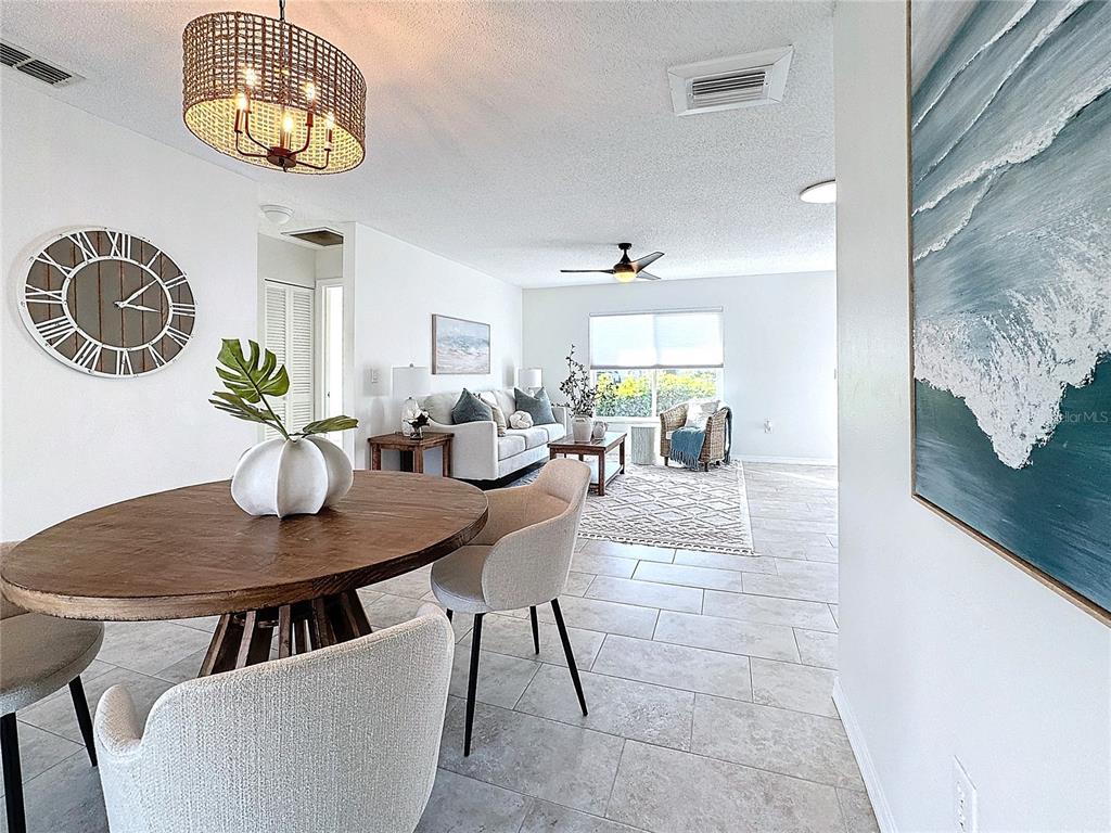 5011 Mangrove Point Road Bradenton, FL 34210 - Photo 31 of 49 a view of a dining room with furniture