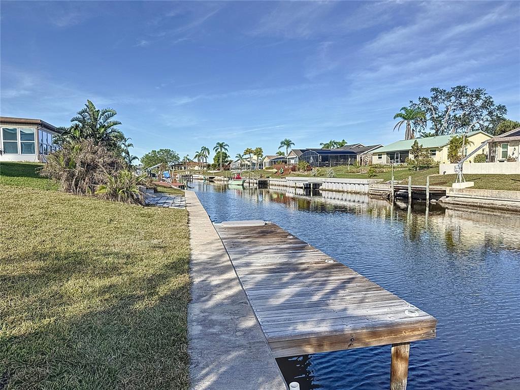 5011 Mangrove Point Road Bradenton, FL 34210 - Photo 45 of 49 a view of a swimming pool and lounge chairs