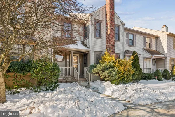a view of a brick building next to a yard