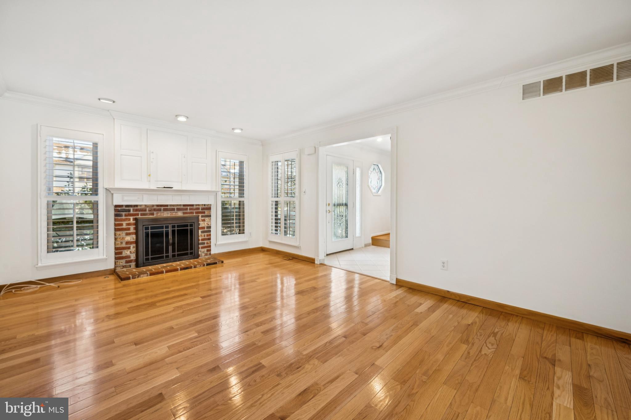 14 Merlot Court Marlton, NJ 08053 - Photo 4 of 24 a view of empty room with wooden floor and fireplace