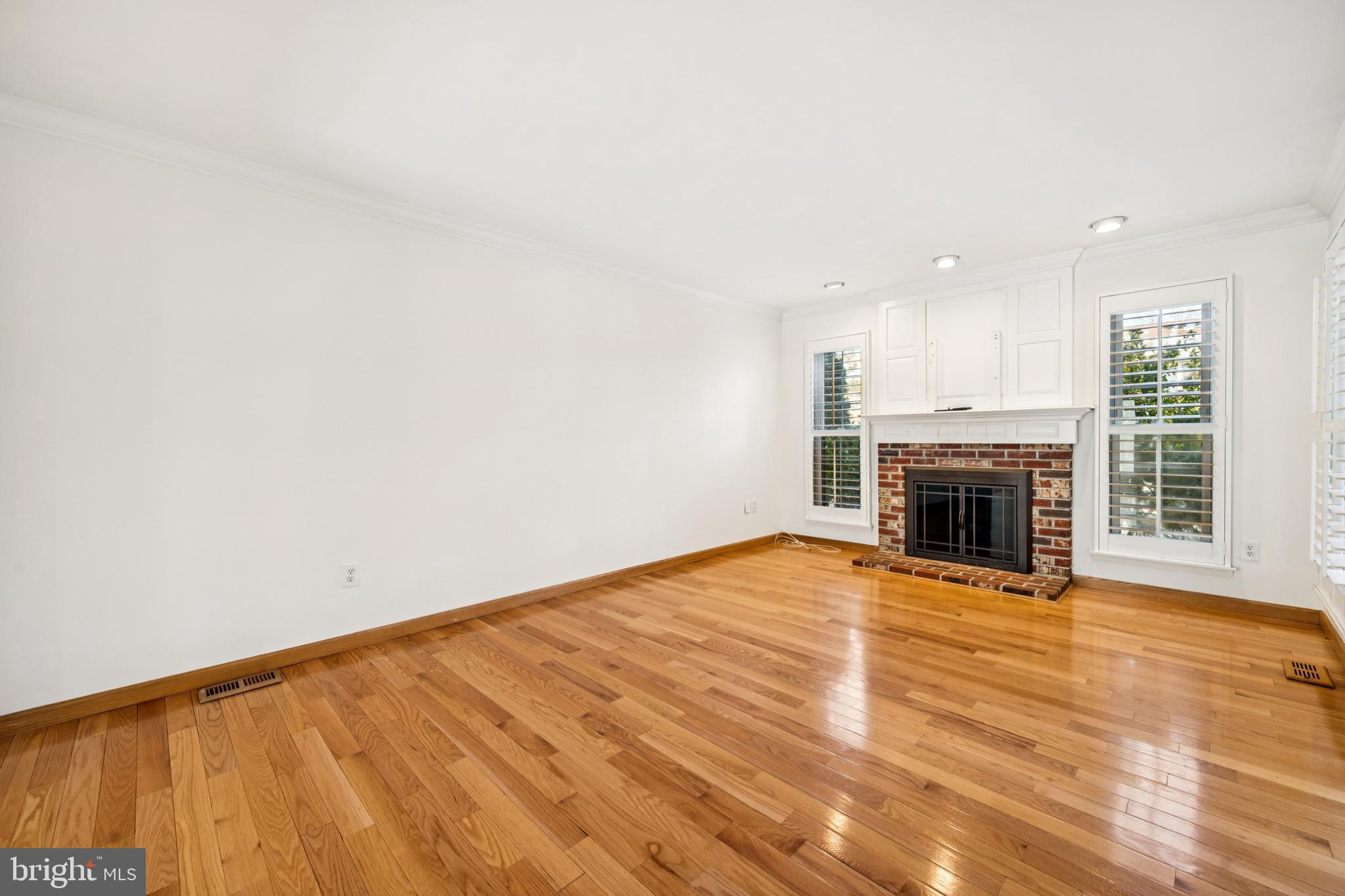 14 Merlot Court Marlton, NJ 08053 - Photo 5 of 24 a view of empty room with wooden floor and fireplace
