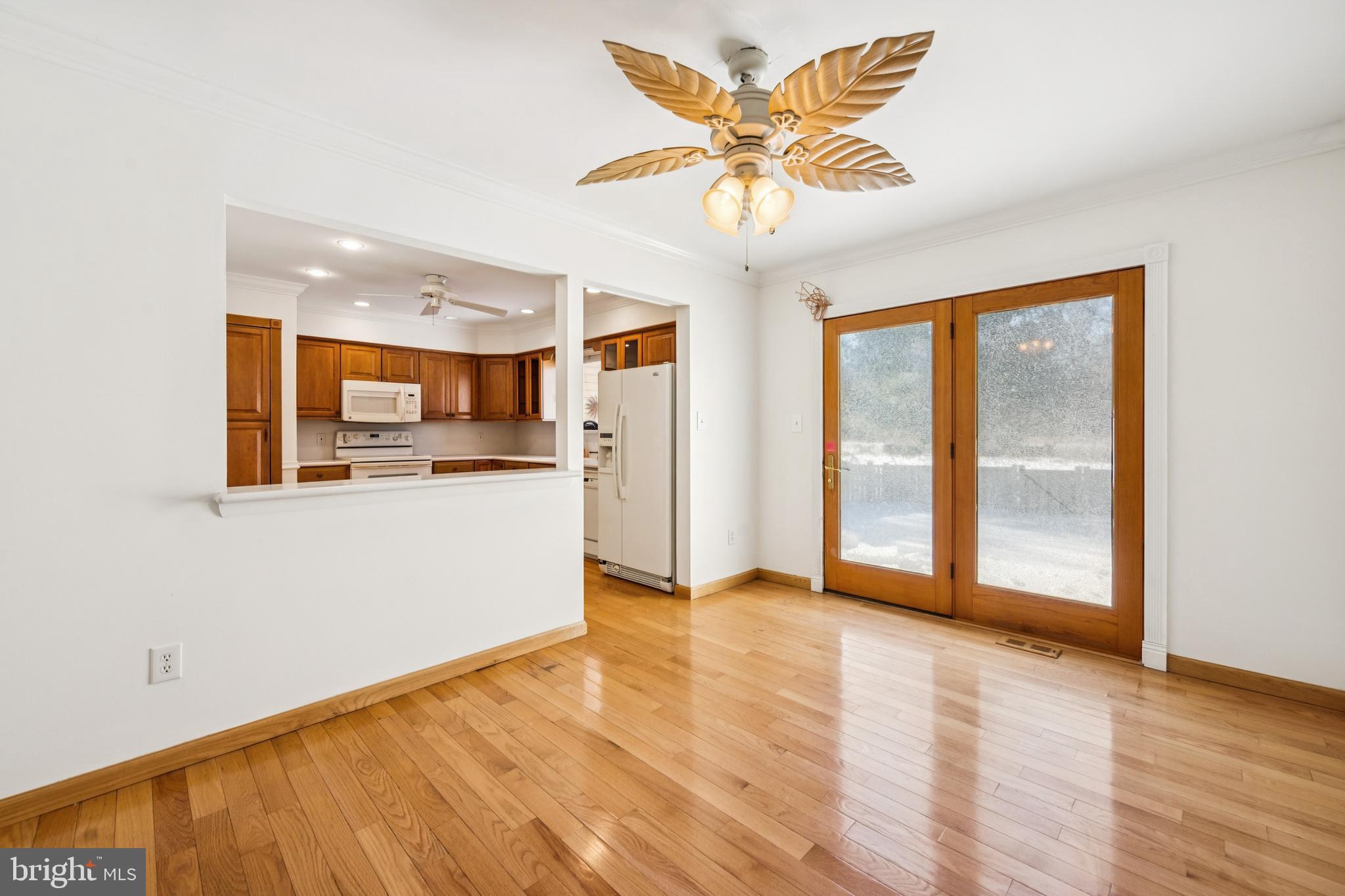 14 Merlot Court Marlton, NJ 08053 - Photo 8 of 24 a view of a kitchen with wooden floor and a ceiling fan