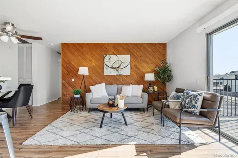 a living room with furniture and a rug