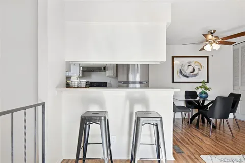 a kitchen with stainless steel appliances granite countertop a refrigerator and microwave
