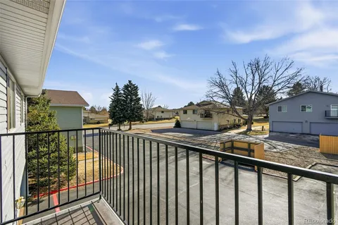 a balcony view with couple of countertop and trees in the background
