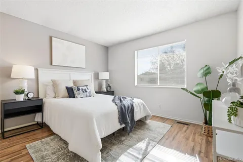 a bedroom with a bed running cycle and a window