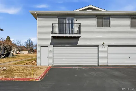 a view of a house with snow on the road