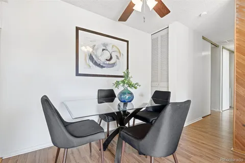 a view of a dining room with furniture window and wooden floor