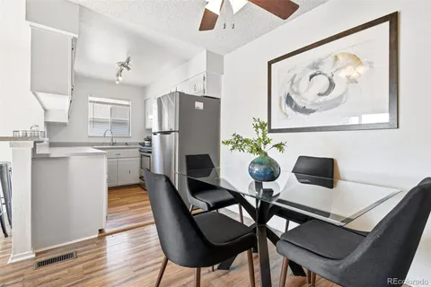 a dining room with furniture and window