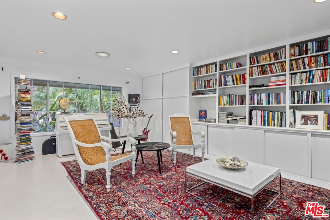 14949 Valley Vista Boulevard Sherman Oaks, CA 91403 - Photo 2 of 9 a work room with furniture bookshelf and a large window