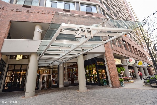 211 East Ohio Street, Unit 2012 Chicago, IL 60611 - Photo 1 of 19 a view of a building with retail shops