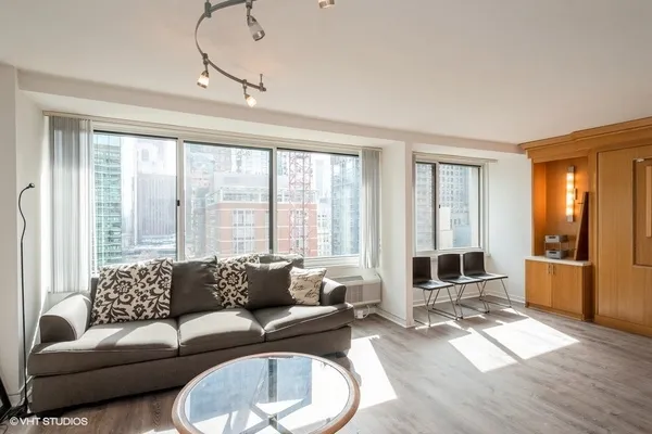 a living room with furniture and a large window