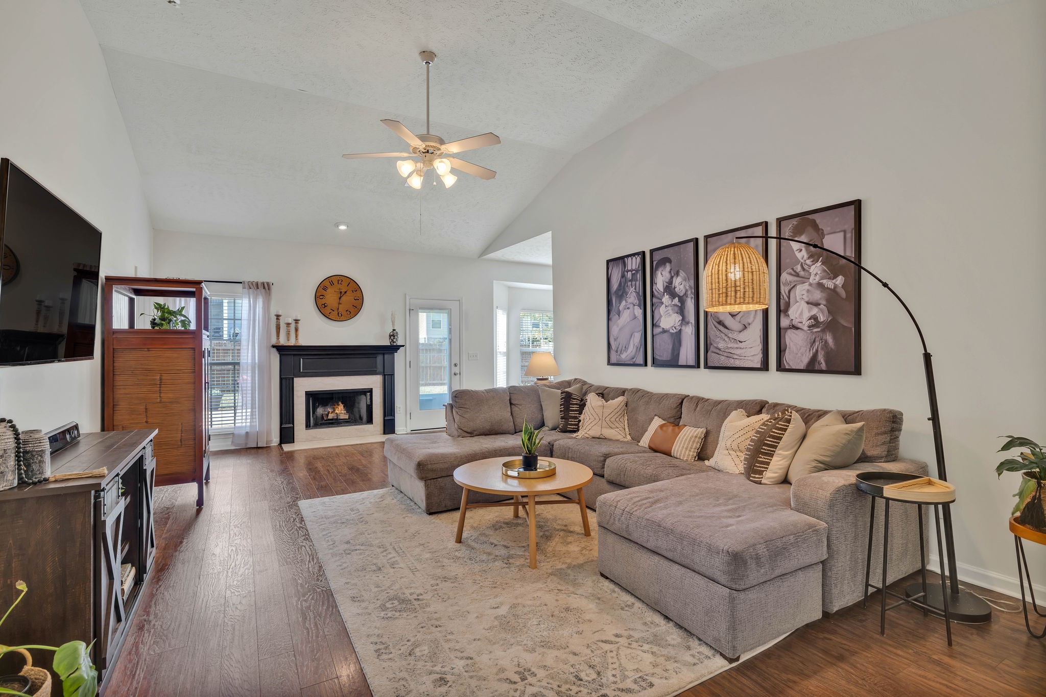 2010 Red Jacket Trace Spring Hill, TN 37174 - Photo 10 of 46 a living room with furniture a fireplace and a flat screen tv