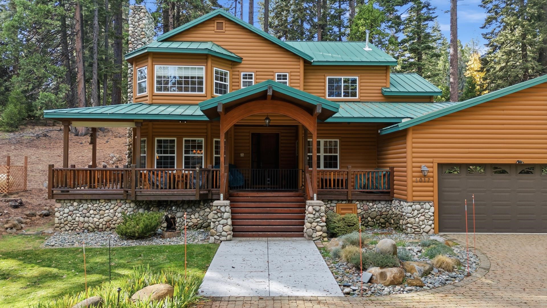 1017 Timber Ridge Road Lake Almanor, CA 96137 - Photo 4 of 45 a front view of a house with garden