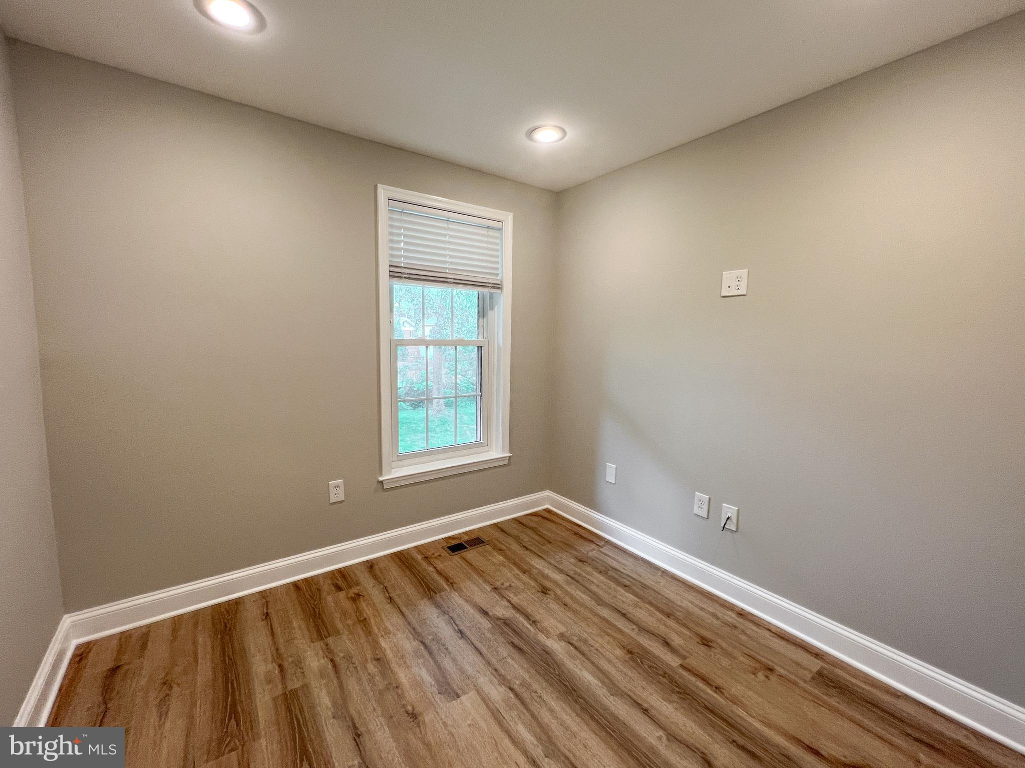 36 Pennydog Court Silver Spring, MD 20902 - Photo 13 of 27 a view of room with window and wooden floor