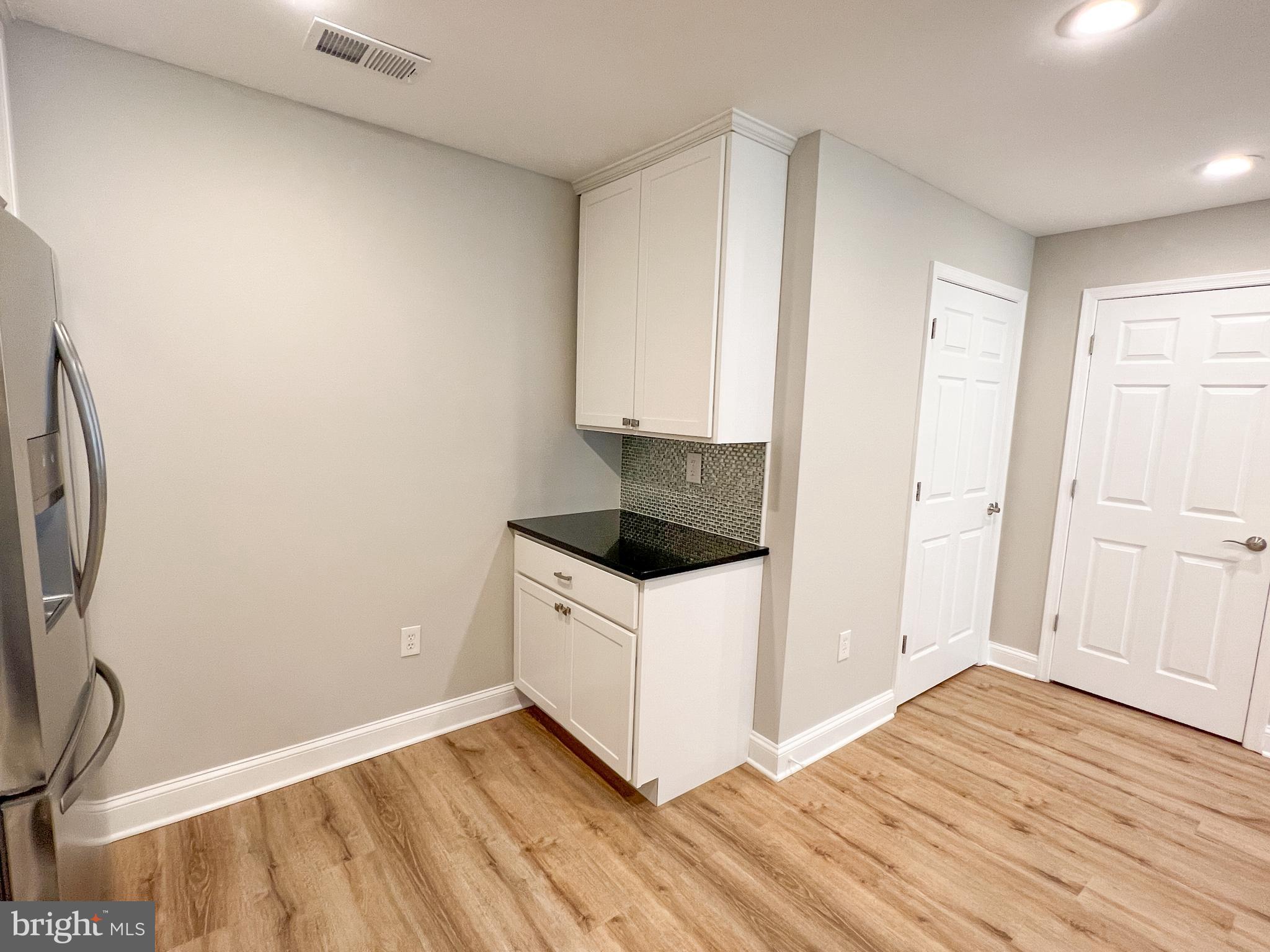36 Pennydog Court Silver Spring, MD 20902 - Photo 24 of 27 a kitchen with a sink and a stove top oven
