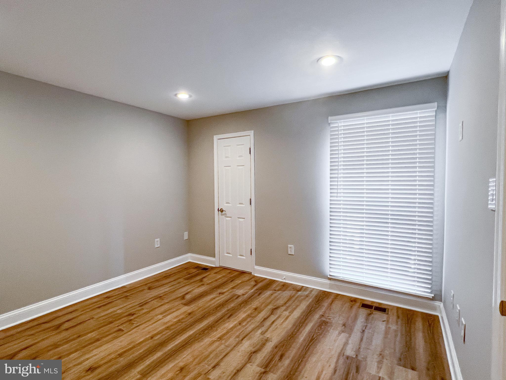 36 Pennydog Court Silver Spring, MD 20902 - Photo 4 of 27 a view of room with window and wooden floor