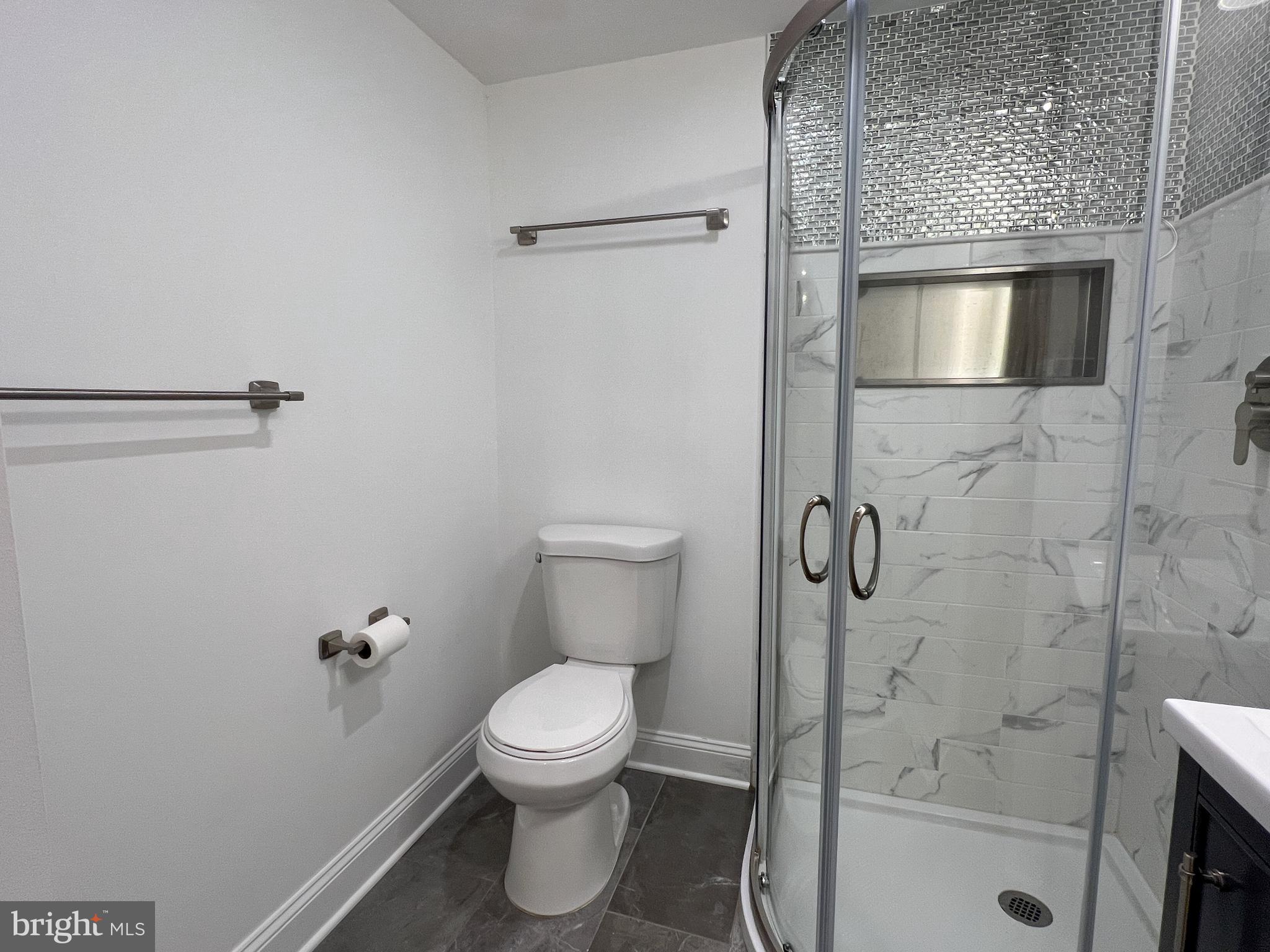 36 Pennydog Court Silver Spring, MD 20902 - Photo 9 of 27 a bathroom with a toilet and a shower