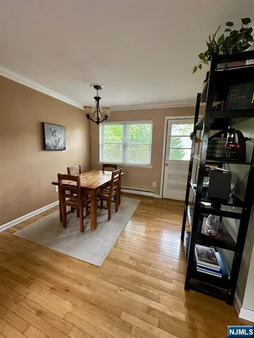 a view of a dining room with furniture and window
