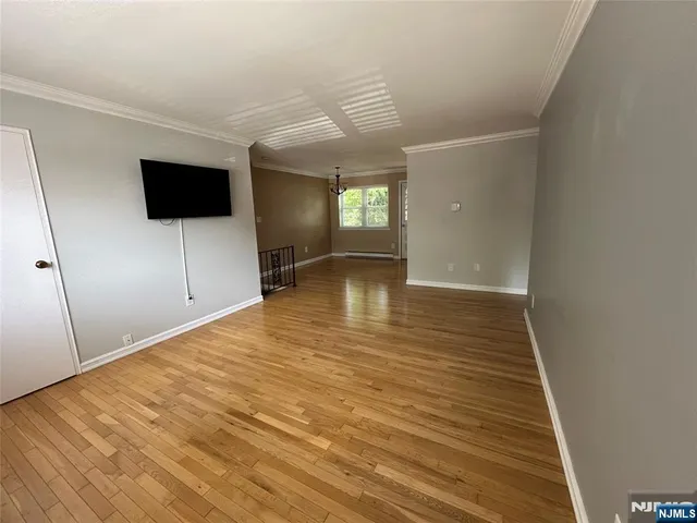 a view of a livingroom with wooden floor