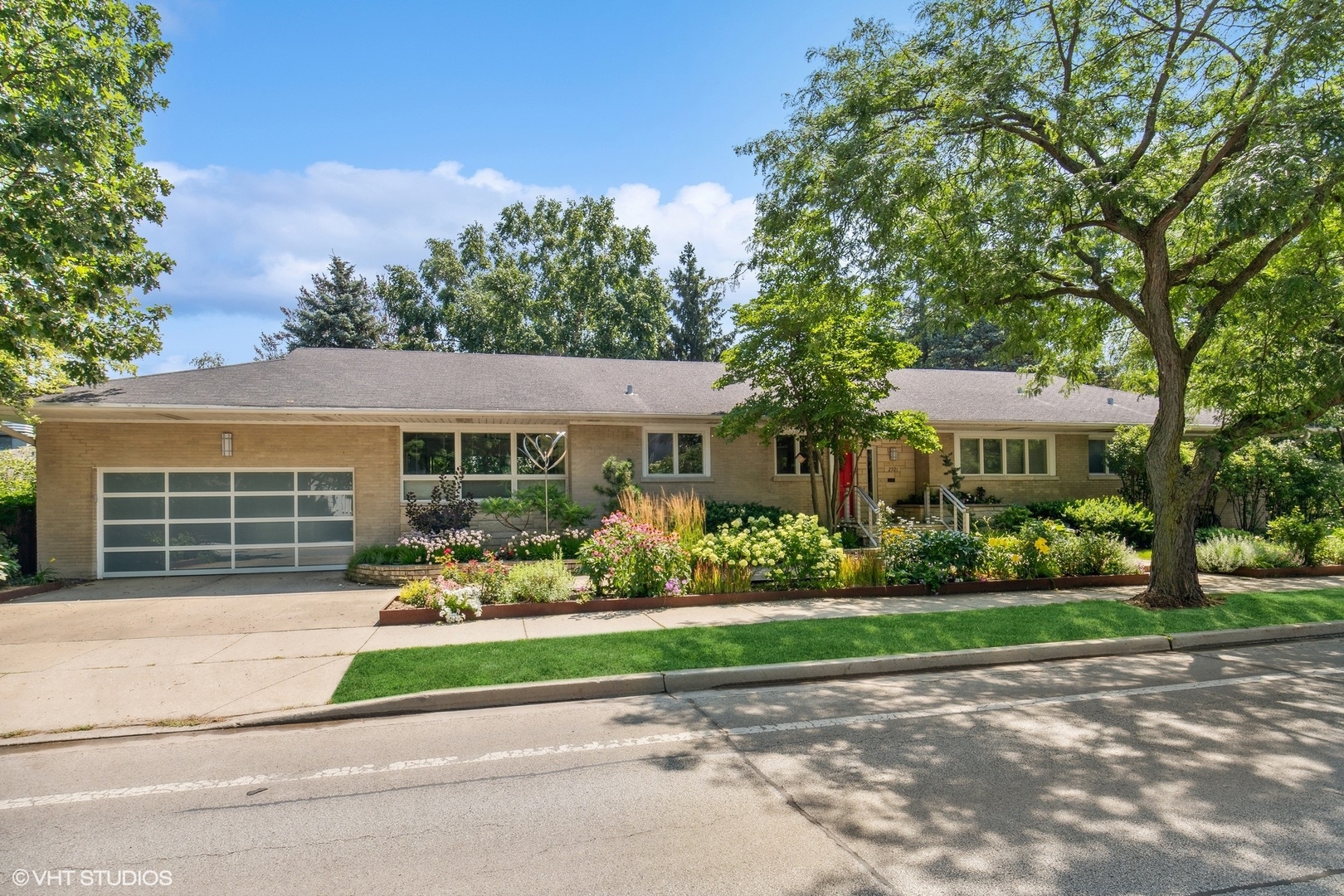 front view of a house with a yard