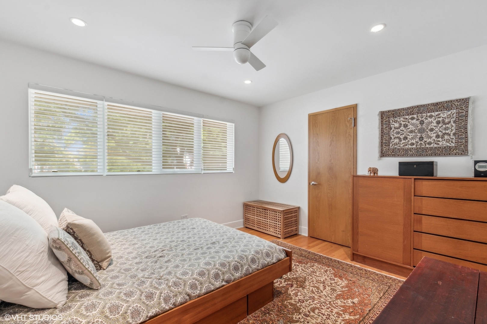 2921 Sheridan Road Evanston, IL 60201 - Photo 22 of 38 a bedroom with a bed dresser and a window