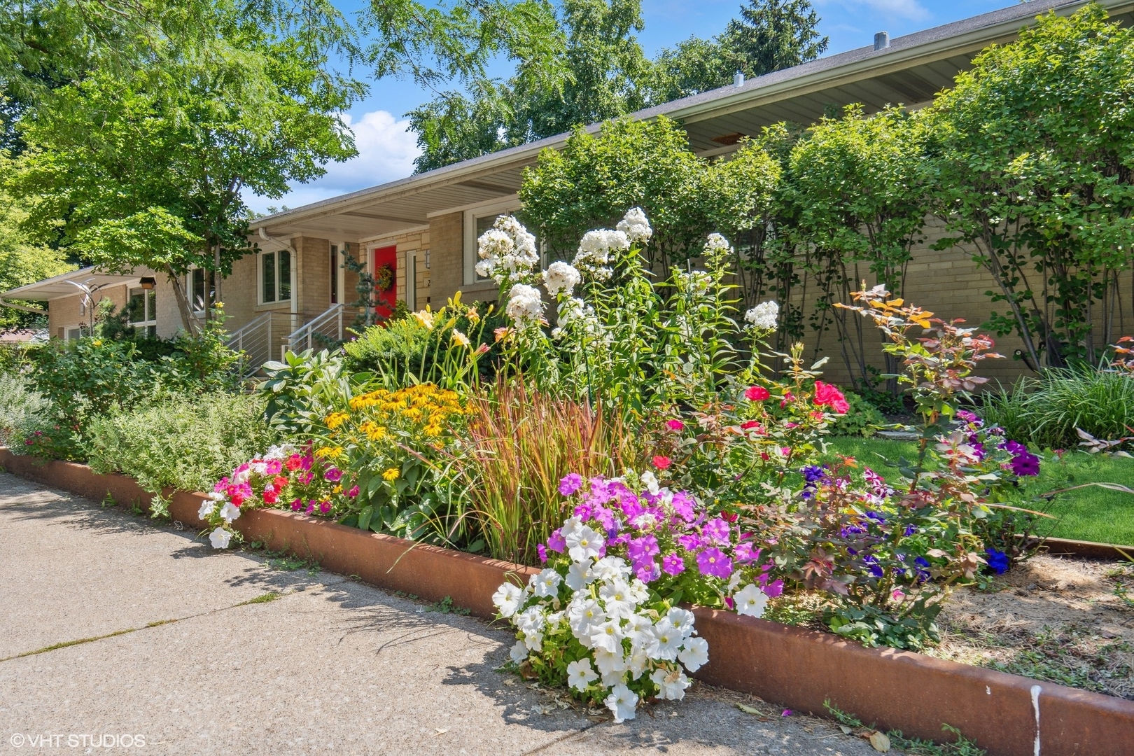 2921 Sheridan Road Evanston, IL 60201 - Photo 34 of 38 a view of a flowers in front of a house with a flower garden