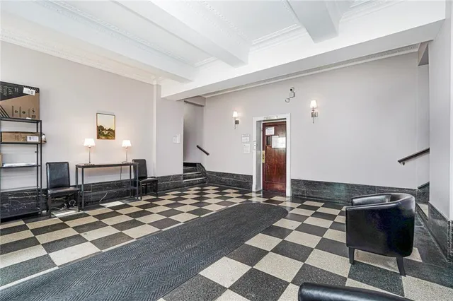 a living room with a couch and a rug