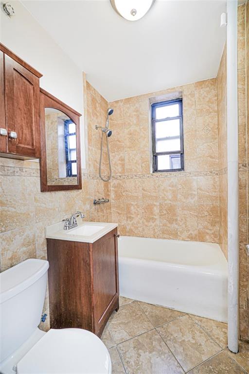 9524 Fort Hamilton Parkway, Unit 601 Brooklyn, NY 11209 - Photo 7 of 13 a bathroom with a toilet a sink and bathtub