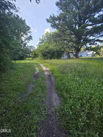 a view of outdoor space with deck and garden