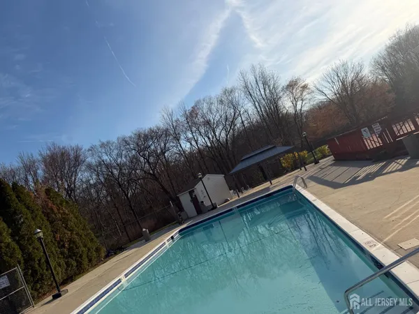 a view of a fountain in front of a house
