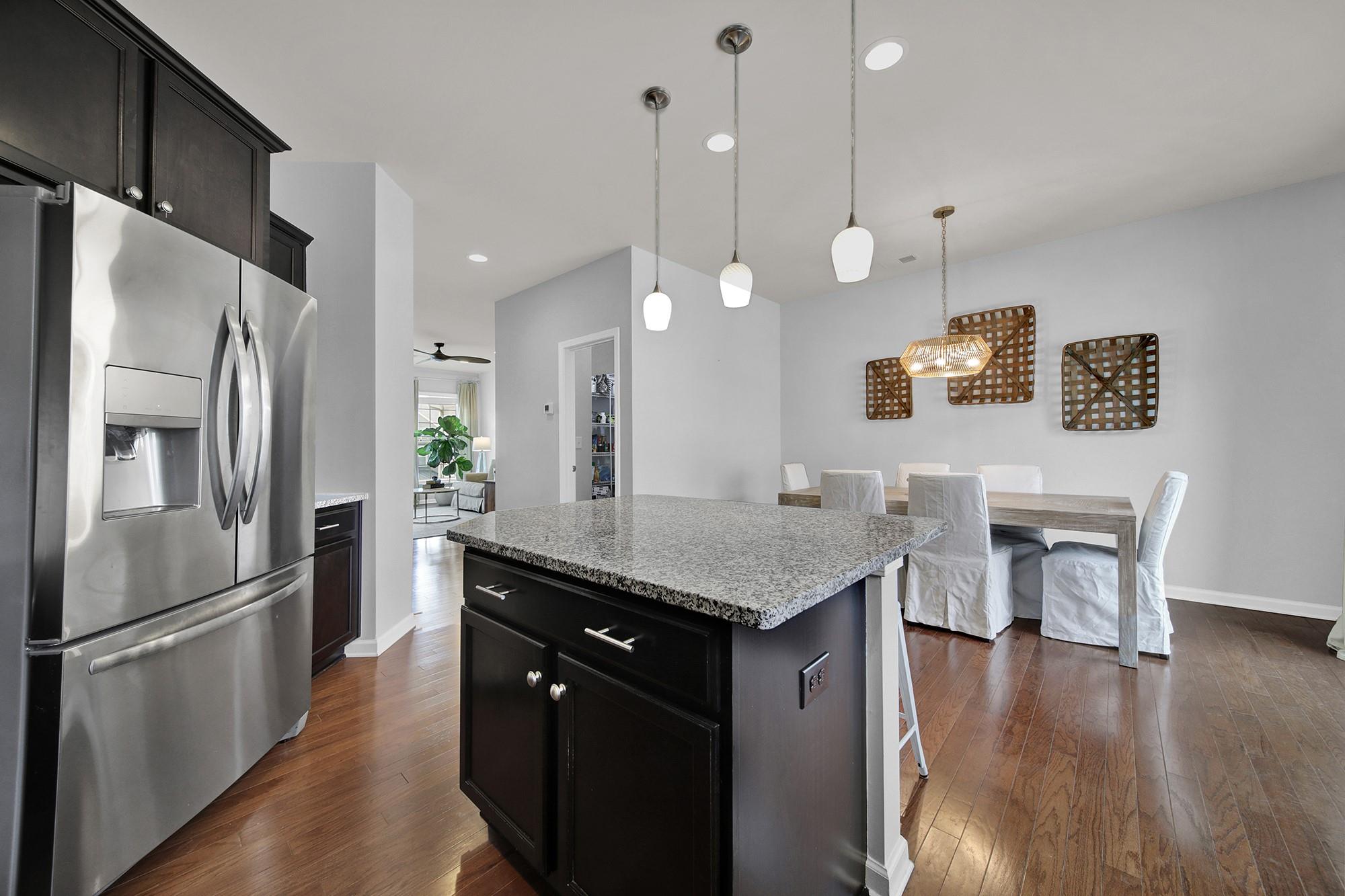 212 Butterfly Place Tega Cay, SC 29708 - Photo 11 of 35 a kitchen with stainless steel appliances granite countertop a refrigerator a sink and a stove