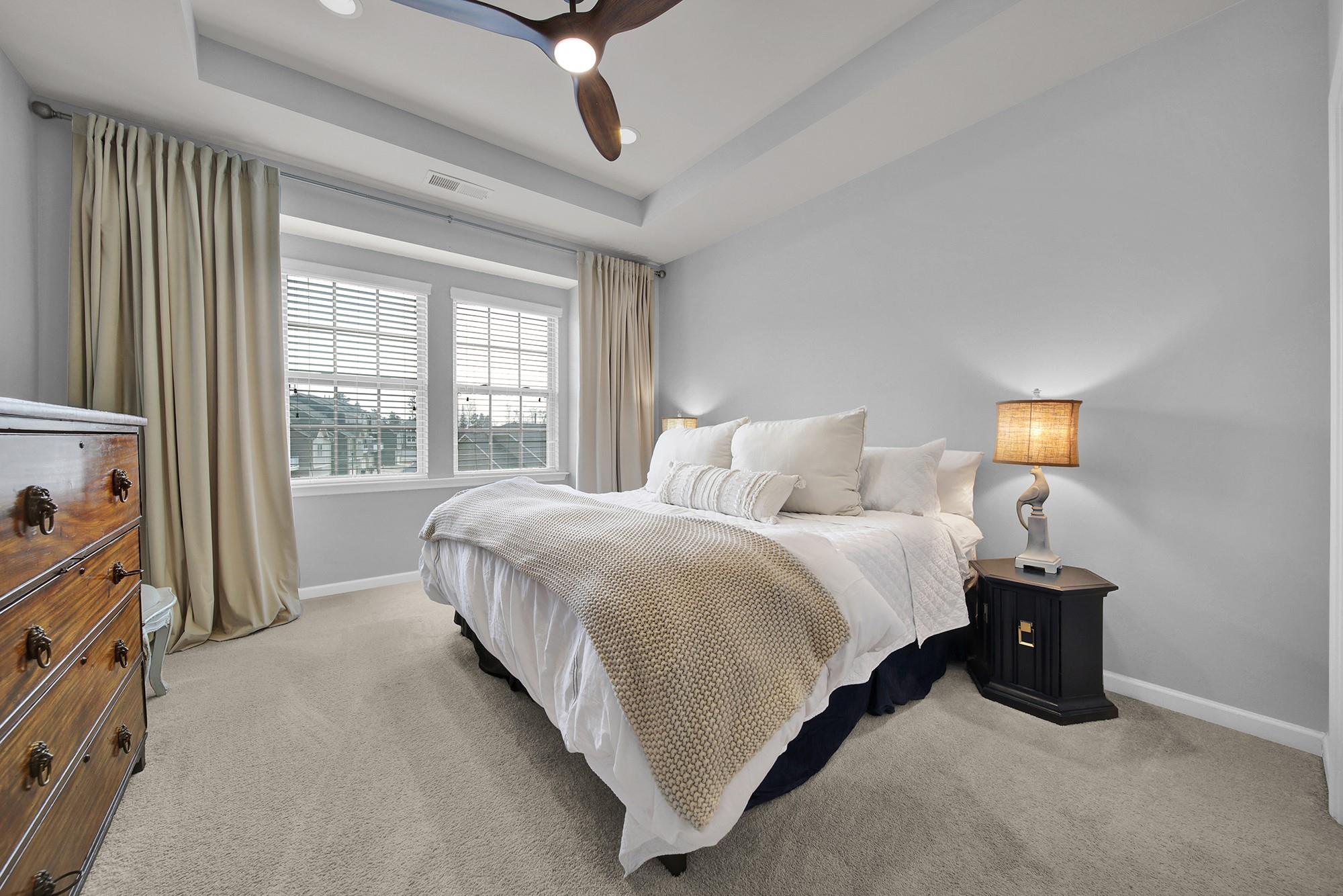 212 Butterfly Place Tega Cay, SC 29708 - Photo 17 of 35 a bedroom with a bed and window
