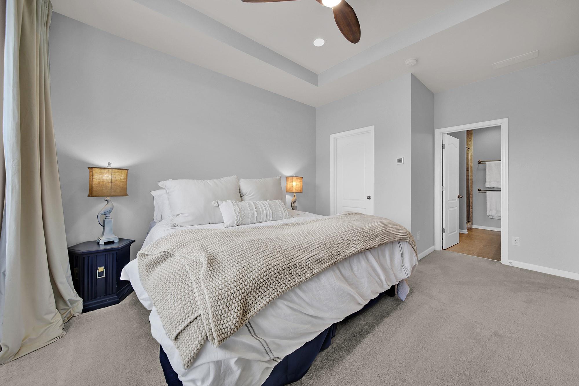212 Butterfly Place Tega Cay, SC 29708 - Photo 18 of 35 a bedroom with bed and window