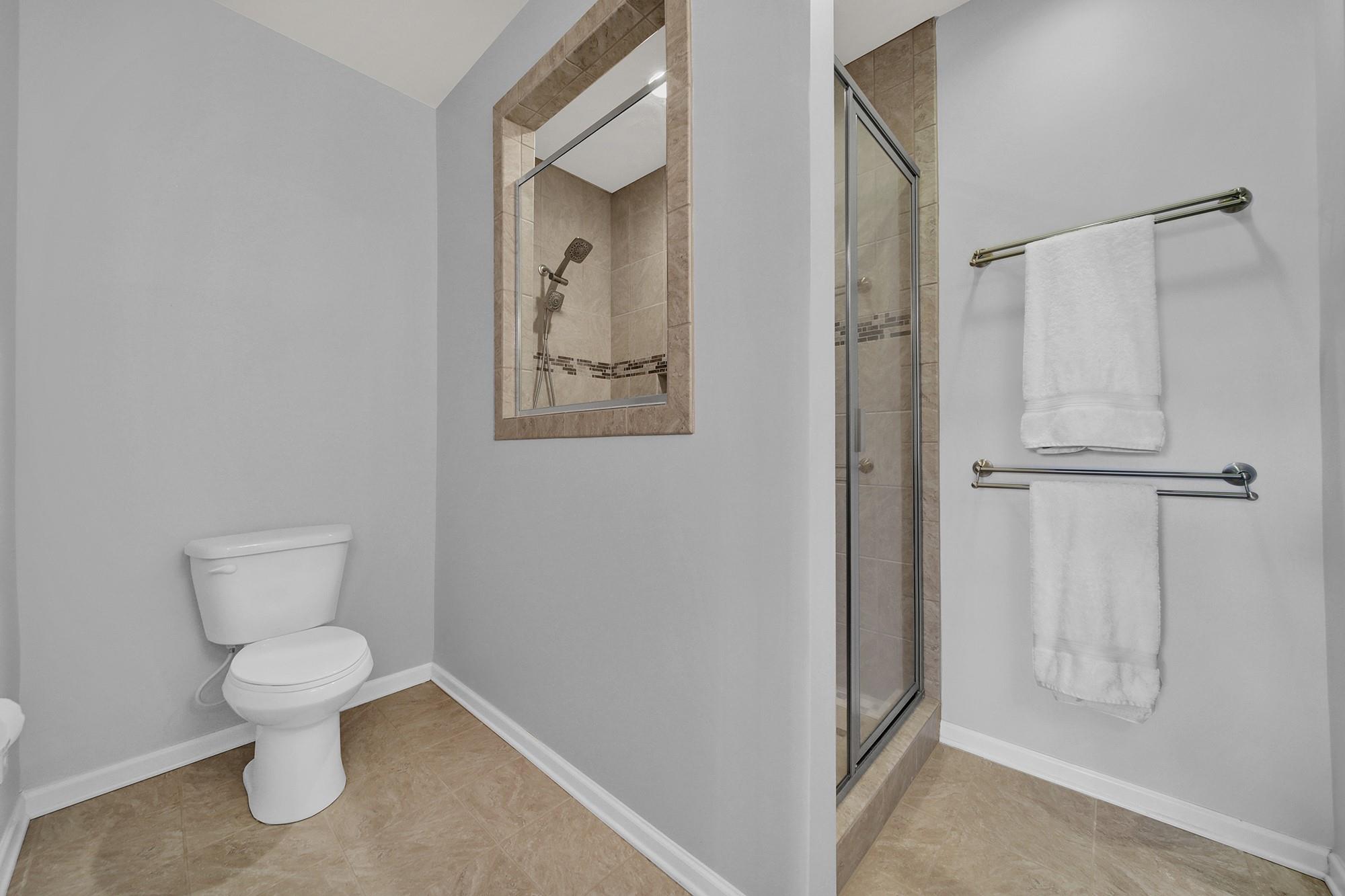 212 Butterfly Place Tega Cay, SC 29708 - Photo 20 of 35 a white toilet sitting next to a bathroom