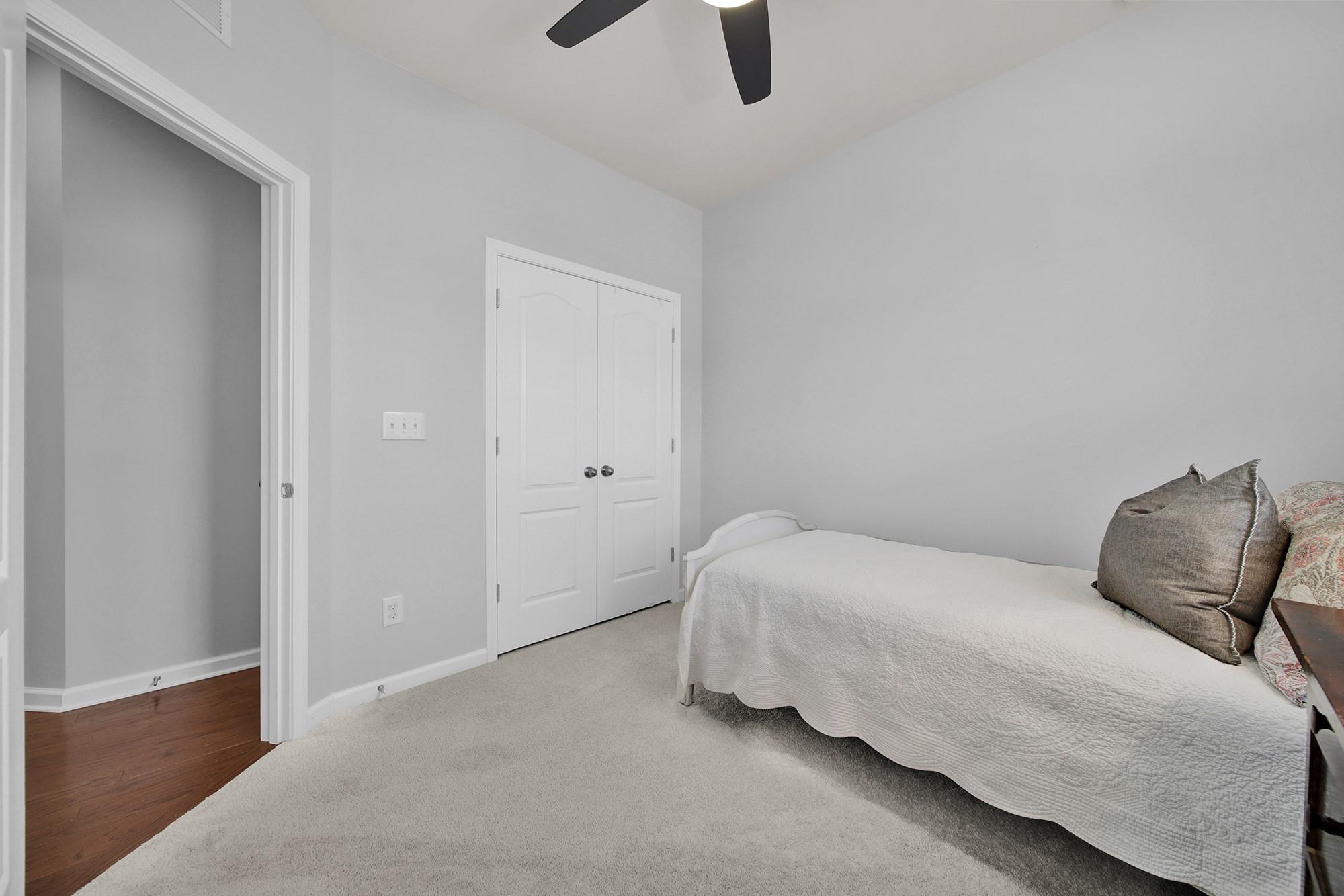212 Butterfly Place Tega Cay, SC 29708 - Photo 22 of 35 a bedroom with a bed and a window