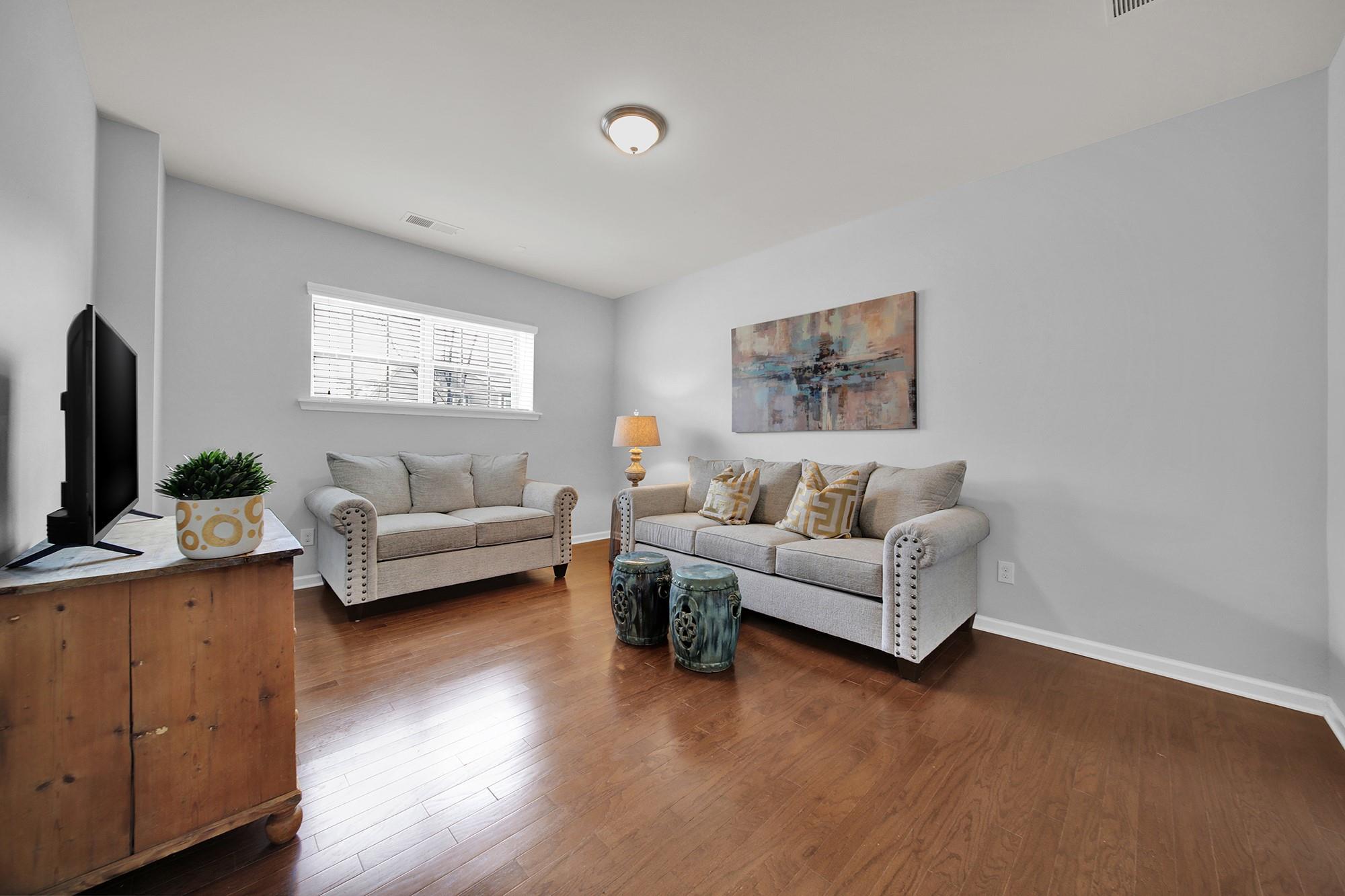212 Butterfly Place Tega Cay, SC 29708 - Photo 25 of 35 a living room with furniture and a flat screen tv