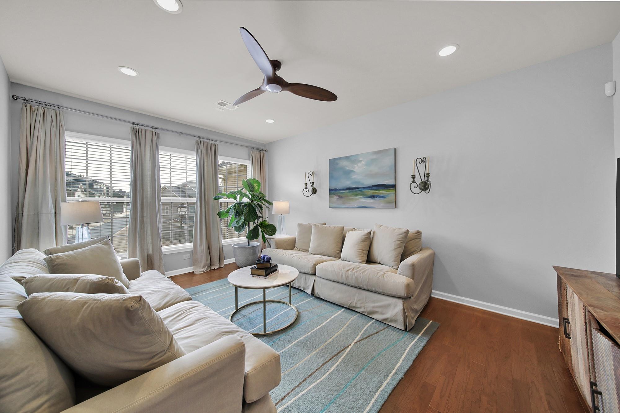 212 Butterfly Place Tega Cay, SC 29708 - Photo 5 of 35 a living room with furniture and a large window