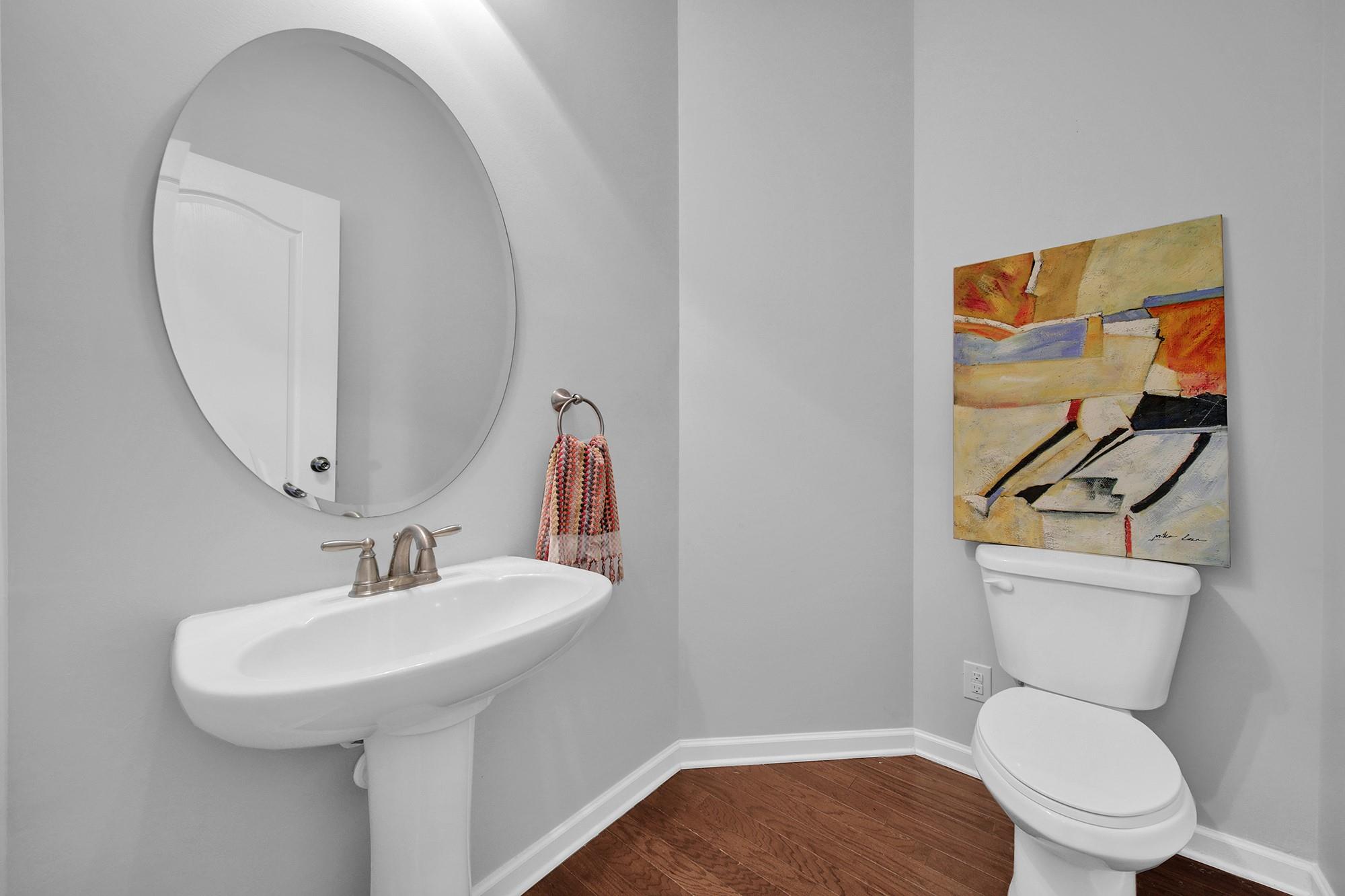 212 Butterfly Place Tega Cay, SC 29708 - Photo 6 of 35 a bathroom with a toilet a sink and mirror