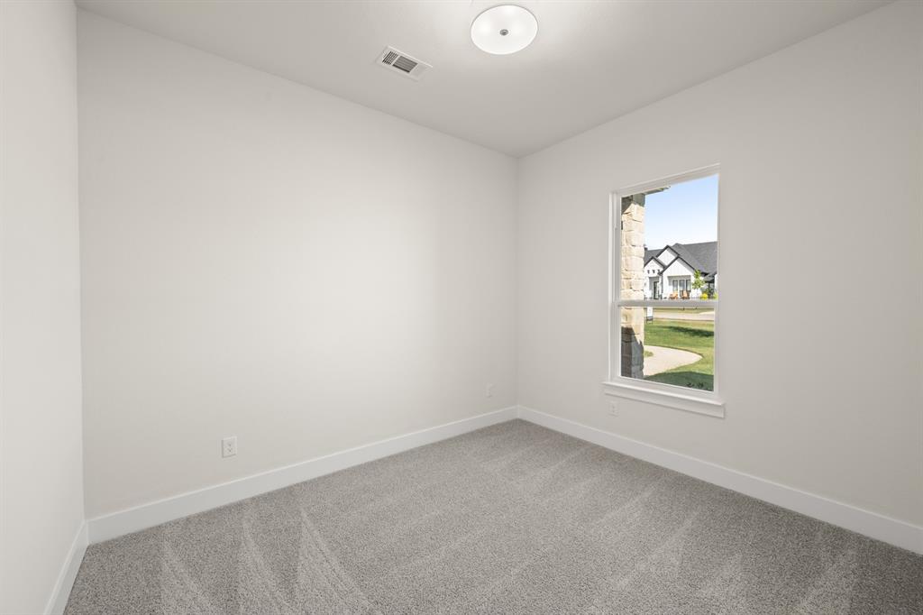1300 Green Ridge Drive Weatherford, TX 76085 - Photo 13 of 24 an empty room with a window