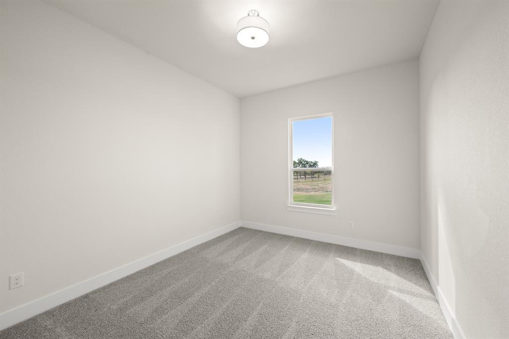 1300 Green Ridge Drive Weatherford, TX 76085 - Photo 14 of 24 an empty room with a window