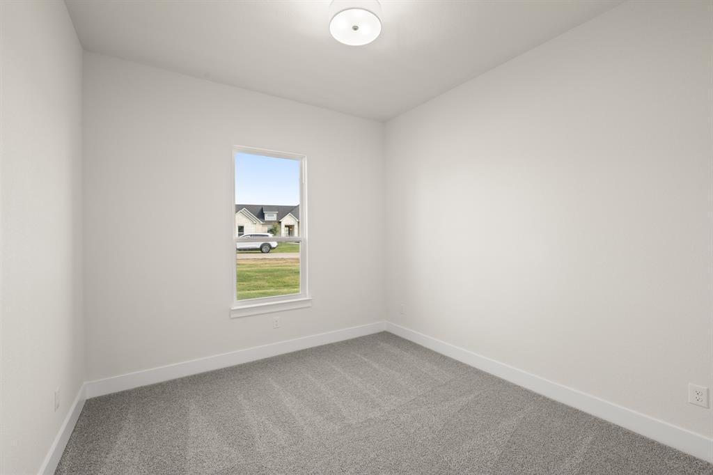 1300 Green Ridge Drive Weatherford, TX 76085 - Photo 15 of 24 an empty room with a window