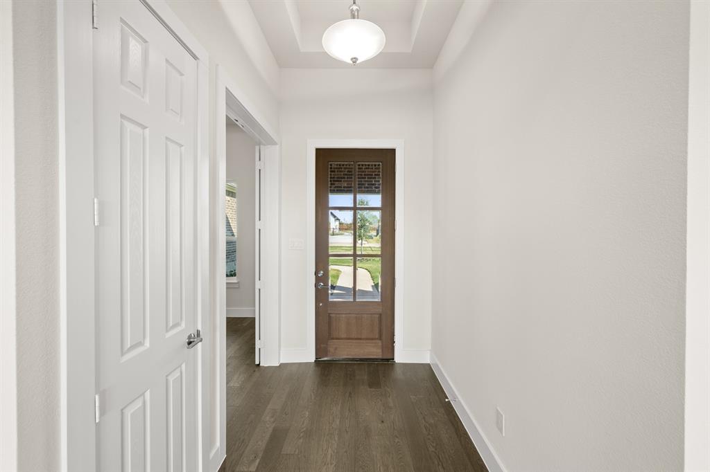 1300 Green Ridge Drive Weatherford, TX 76085 - Photo 3 of 24 a view of an empty room with wooden floor and a window