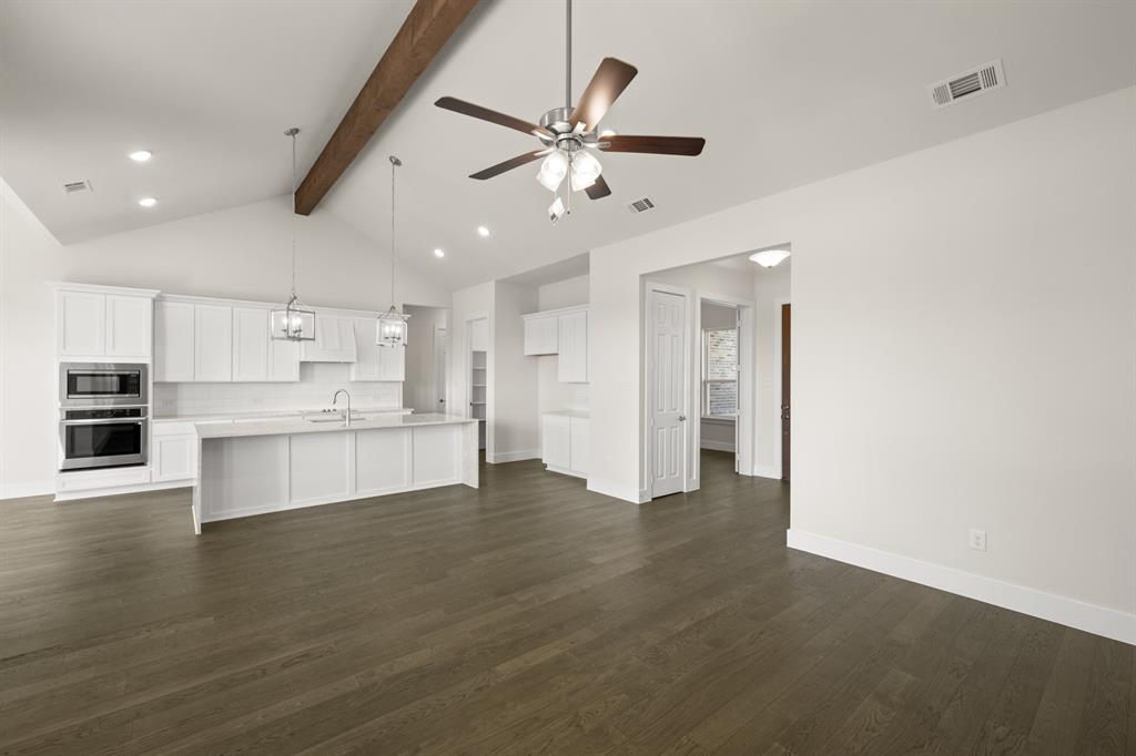 1300 Green Ridge Drive Weatherford, TX 76085 - Photo 6 of 24 a view of kitchen with wooden floor and window