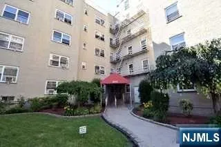 a front view of a building with an outdoor seating