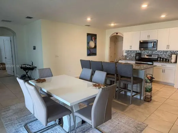 a view of a dining room with furniture