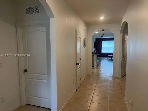 a view of a hallway with a furniture