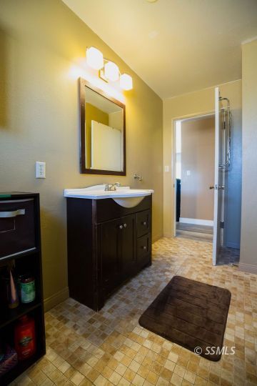2030 South Inyo Street Ridgecrest, CA 93555 - Photo 32 of 42 a bathroom with a sink and a mirror