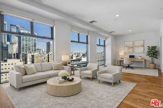 a living room with furniture and a large window